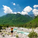 Woman standing in front of mountains in Northern Albania