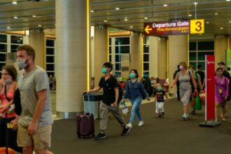 Passengers at Bali Airport urged to adhere to health protocols as Covid cases rise again