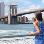 Woman in NYC Looking at Brooklyn Bridge