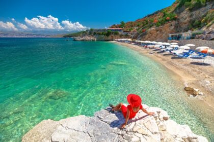 Woman relaxing on beach in Albanian Riviera