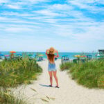 Woman walking towards the beach, Myrtle Beach, South Carolina