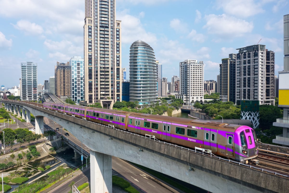Purple train in Taiwan zooming through city