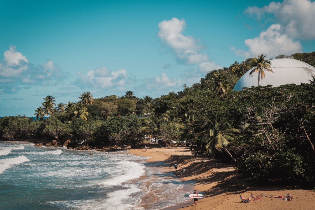 Rincon, Puerto Rico Beach with surfers on a sunny day