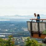 Couple enjoying scenic views over Coffs Harbour from Forest Sky Pier, Niigi Niigi - Sealy Lookout, Coffs Harbour.