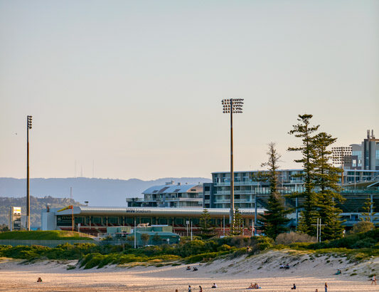 People enjoying the sand and surf at Main Beach, Wollongong.