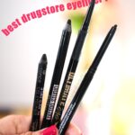 Close up of hand holding four eyeliner pencils with pink text: Best Drugstore Eyeliner Pencils